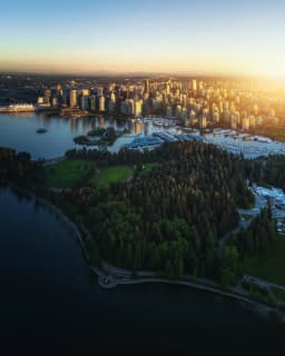 an aerial view of a city and a body of water